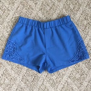 Blue shorts with crochet sides